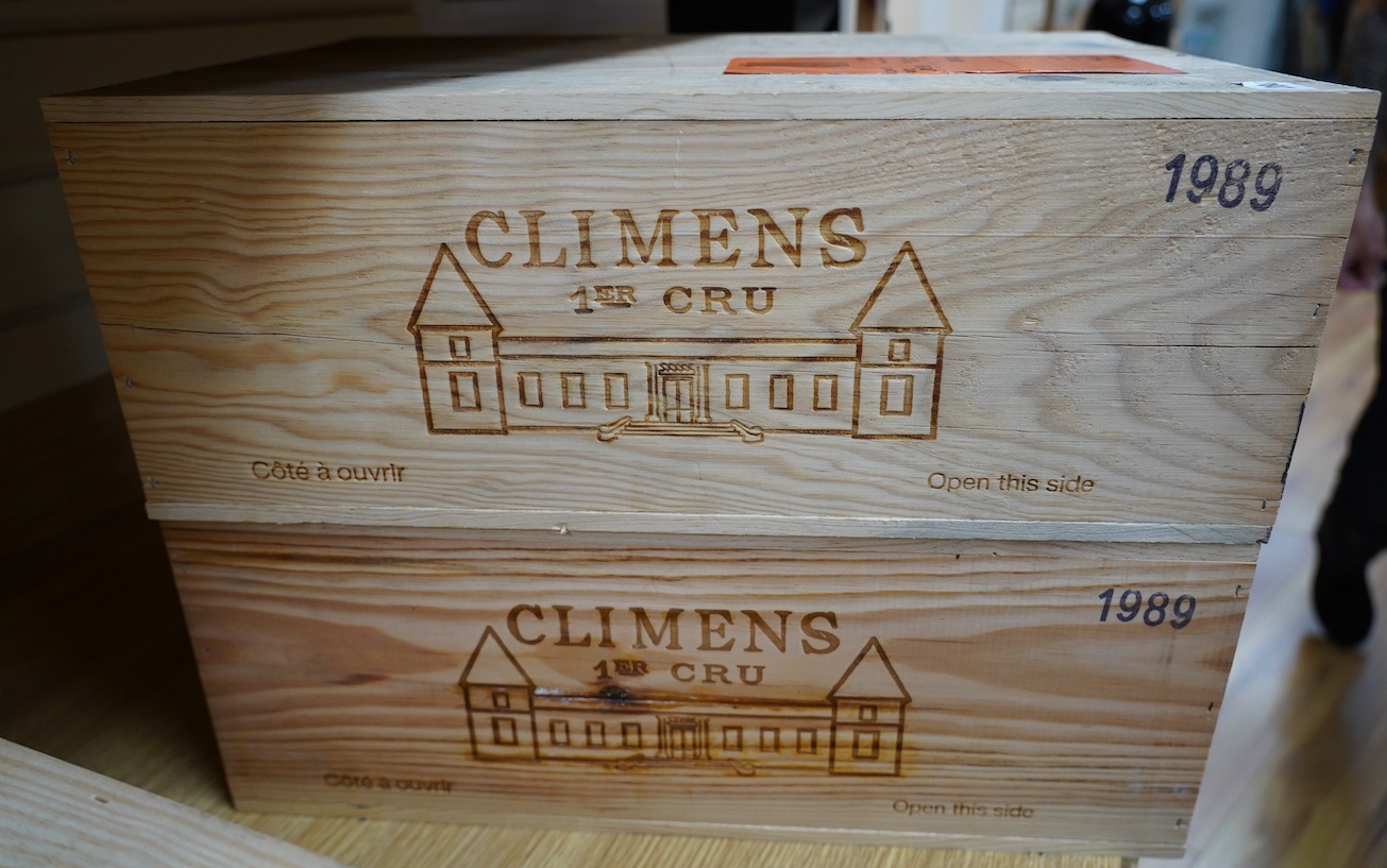 Two sealed cases of twelve bottles (twenty-four bottles) of 1989 Chateau Climens, Sauternes, in OWC's, purchased en primeur from The Wine Society. Condition - good